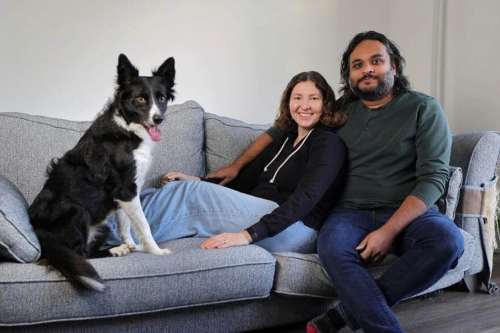 A couple at home with their dog