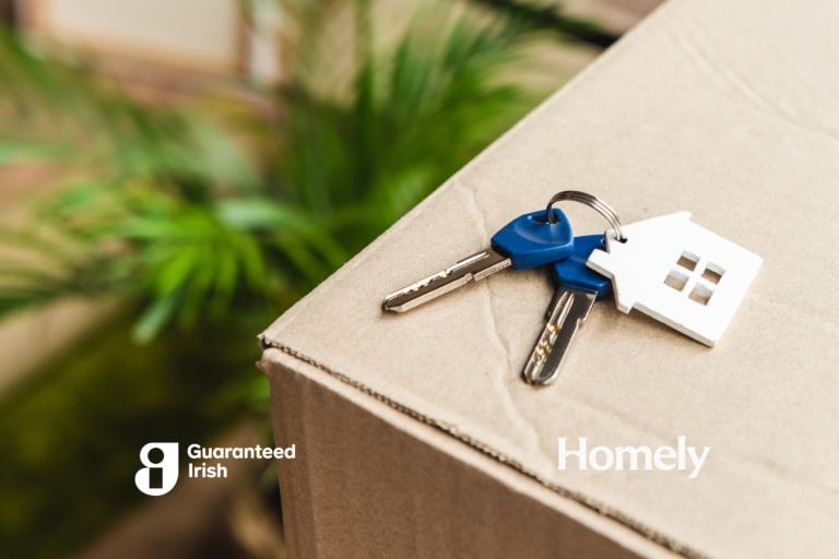 Download close-up view of keys from new house on cardboard box during relocation